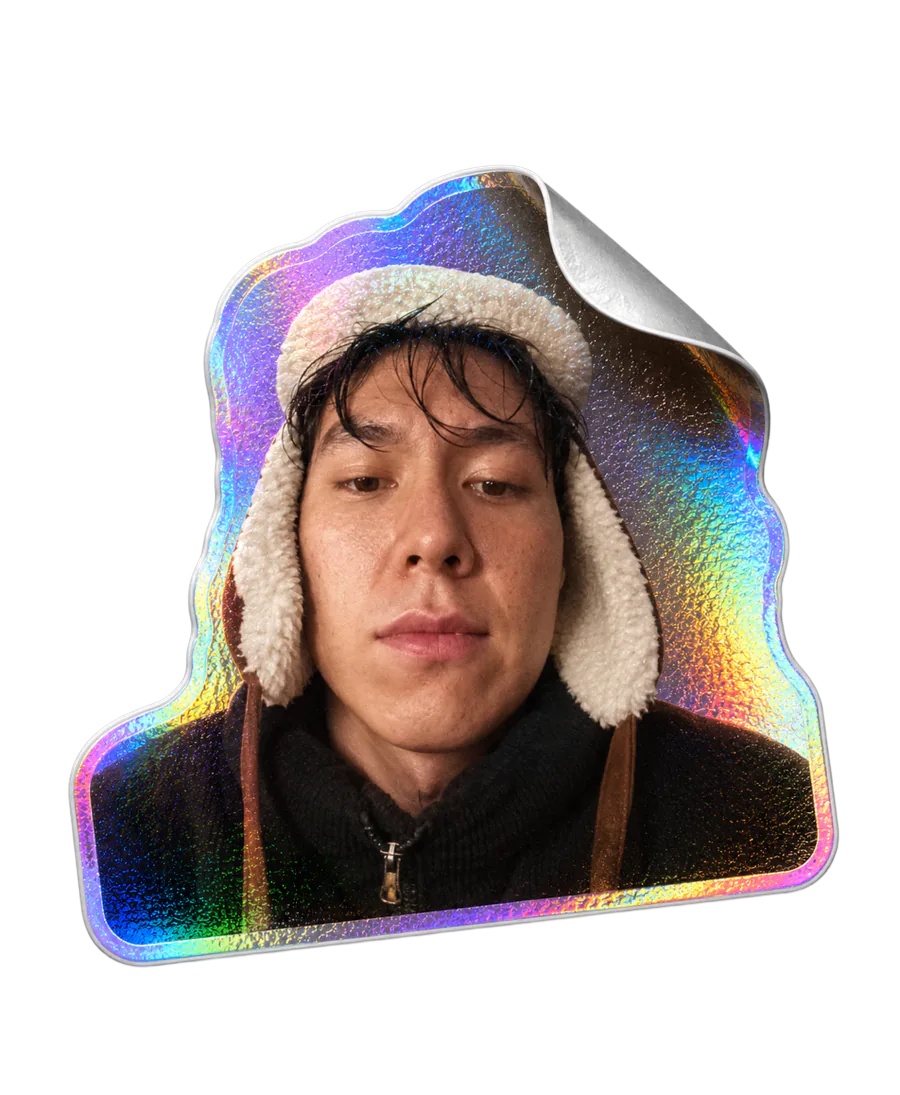 Portrait of Arnoo Erkinbekov framed by iridescent foil