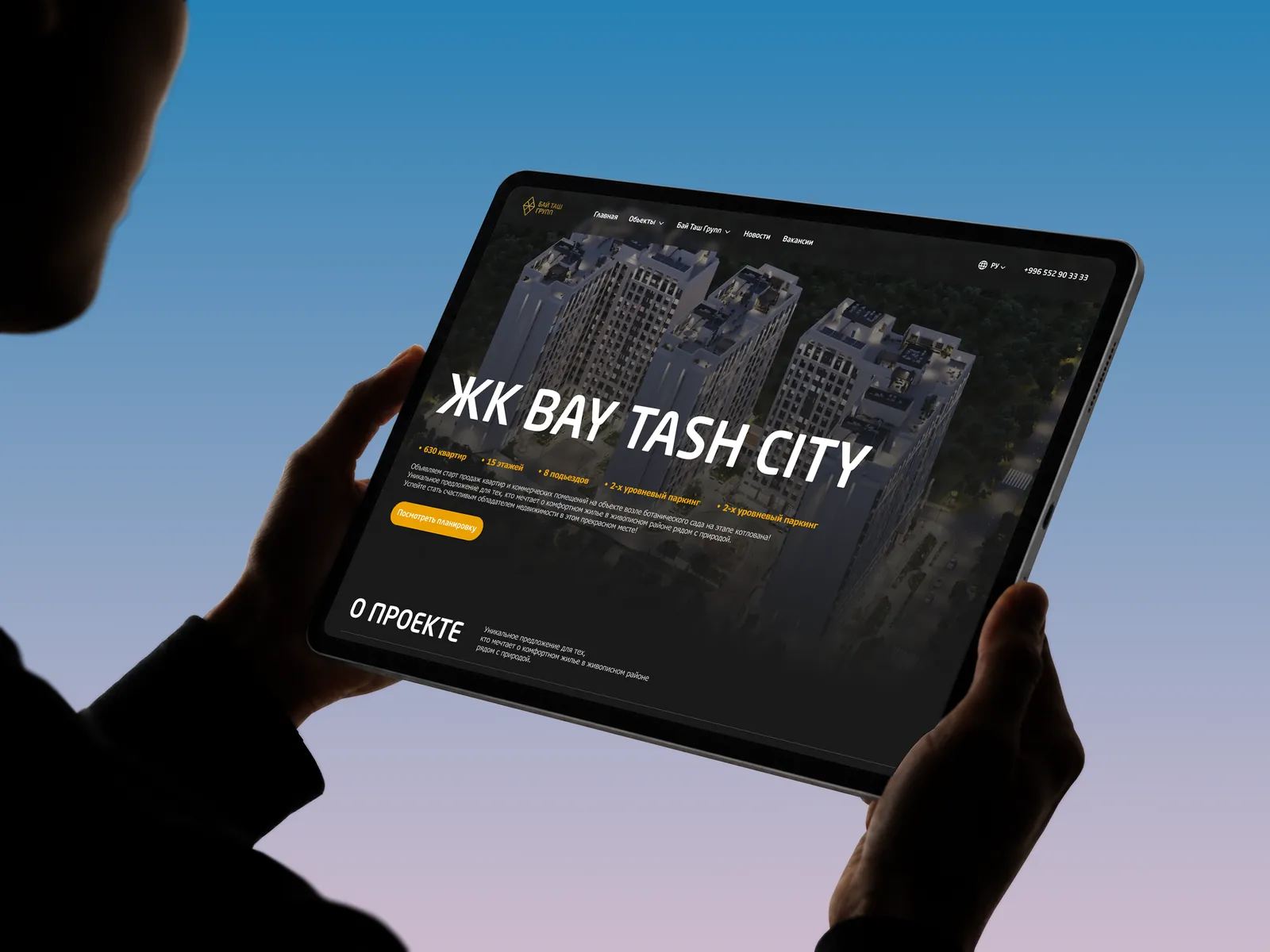 BAY TASH residential complex website on a tablet